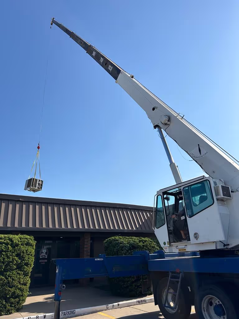 XTS Crane and Rigging lifting commercial equipment